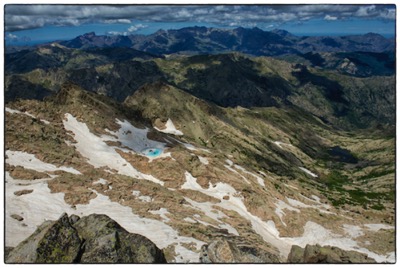 Corsica, a view from the summit of Monte Rotondo : lac de Galiera, the highest Corsican lake (the blue spot) and far on the horizon : Capu Tafunatu, Paglia Orba, Punta Minuta, Capu Larghia, Monte Cinto, Capu Verdatu, Capu Biancu, Monte Padro - photo Tomasz http://rdvnature.com rendez-vous nature & aventure